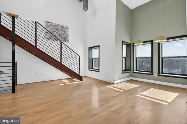 a view of an empty room with windows