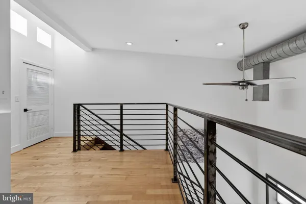 a view of a room with a ceiling fan