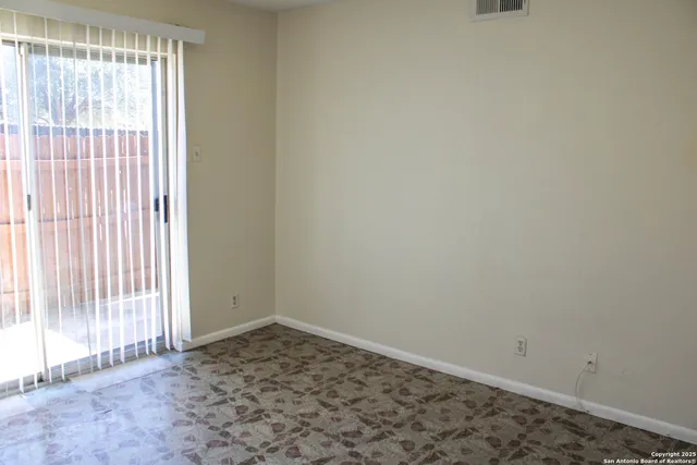 a view of a room that has a window in it