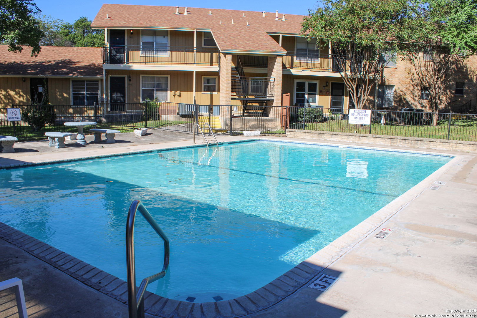 923 Vance Jackson Road, Unit 1007 San Antonio, TX 78201 - Photo 2 of 43 a view of a building with sitting area and swimming pool
