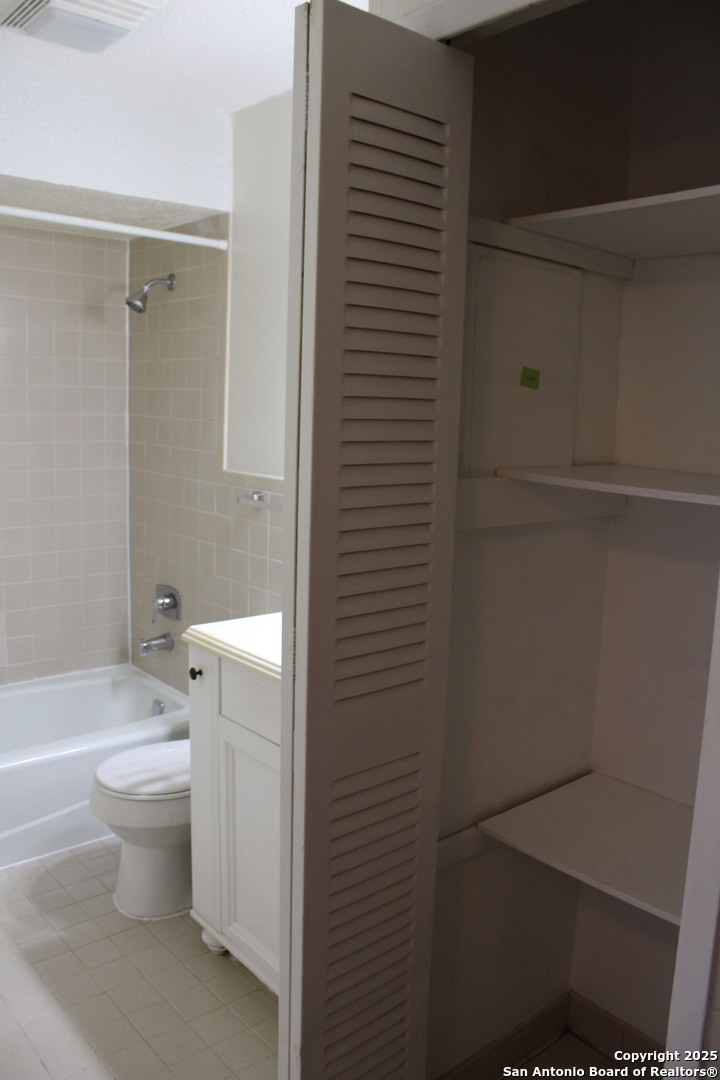923 Vance Jackson Road, Unit 1007 San Antonio, TX 78201 - Photo 37 of 43 a bathroom with a toilet and a shower