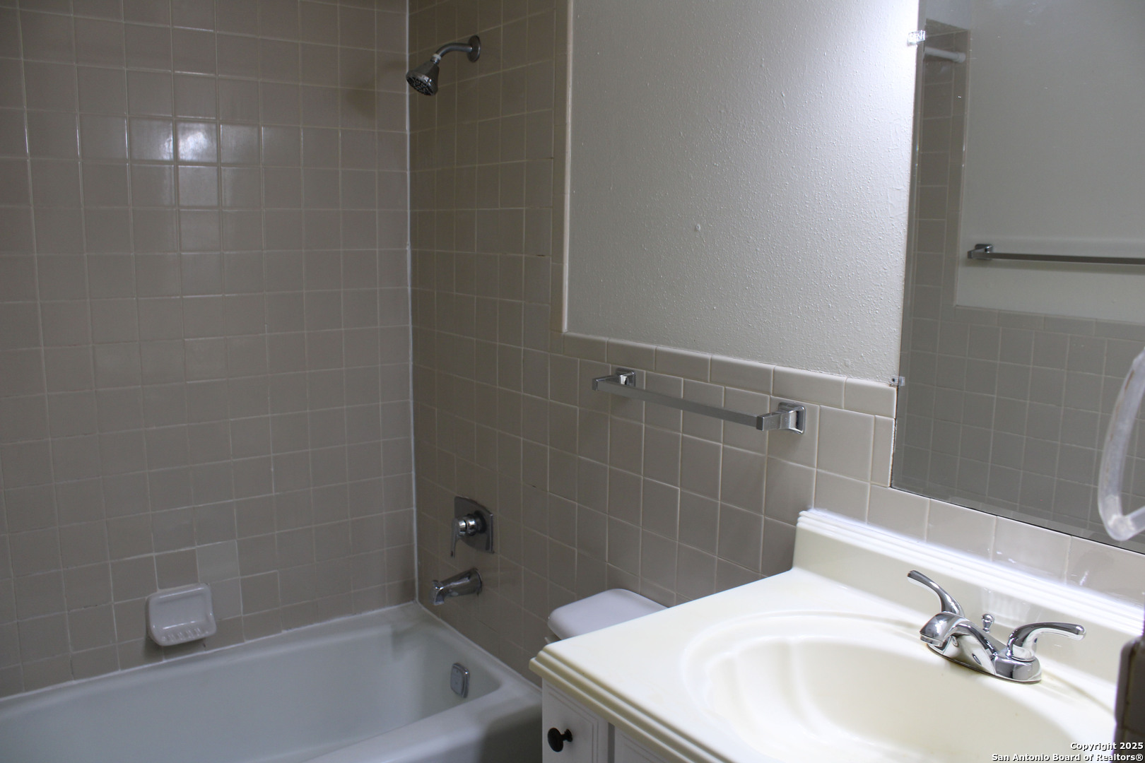 923 Vance Jackson Road, Unit 1007 San Antonio, TX 78201 - Photo 38 of 43 a bathroom with a sink a toilet and shower