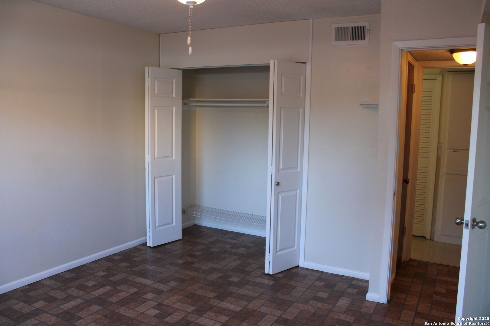 923 Vance Jackson Road, Unit 1007 San Antonio, TX 78201 - Photo 41 of 43 a view of an empty room with closet area