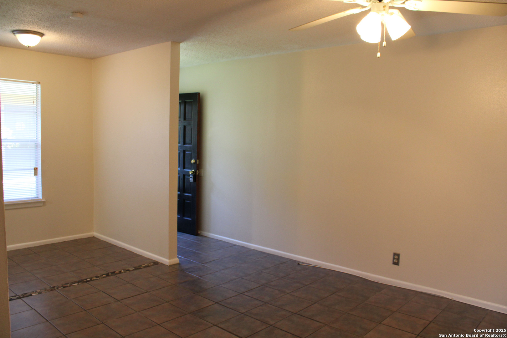 923 Vance Jackson Road, Unit 1007 San Antonio, TX 78201 - Photo 43 of 43 an empty room with a fan and a window