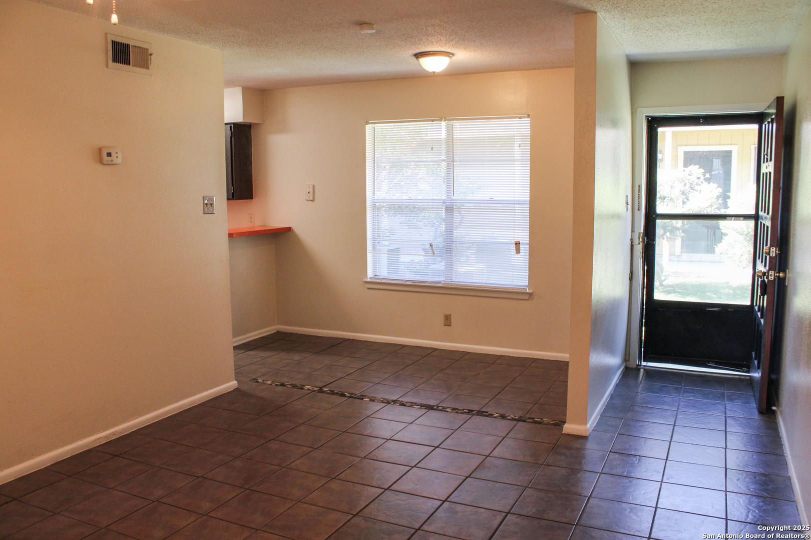 923 Vance Jackson Road, Unit 1007 San Antonio, TX 78201 - Photo 5 of 43 a view of an empty room with a window