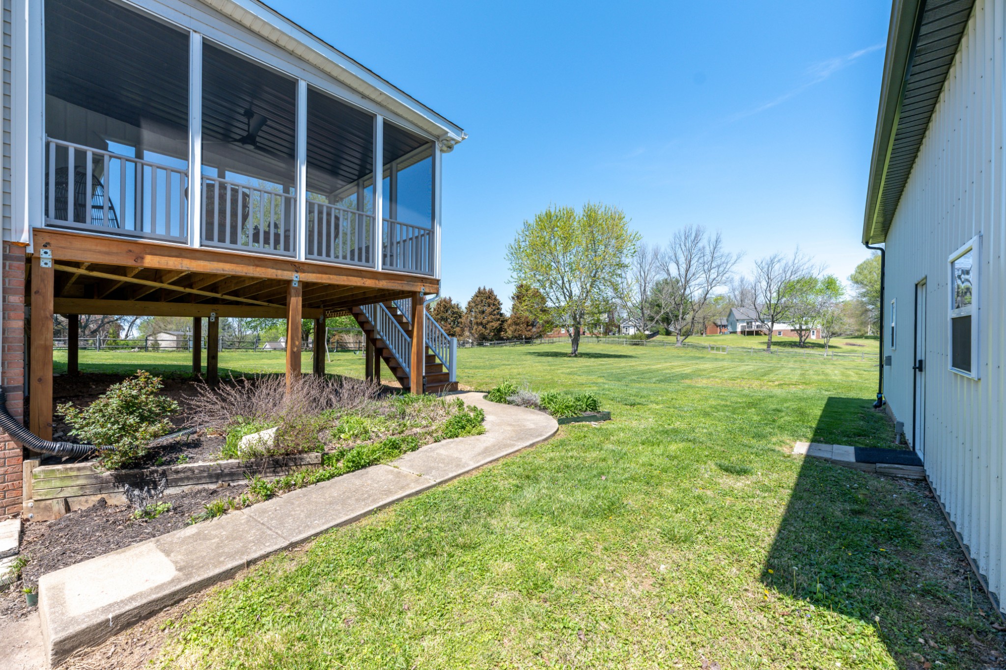 2011 Bradbury Road Adams, TN 37010 - Photo 42 of 46 a view of a house with backyard and trees