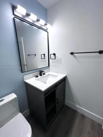 a bathroom with a sink and mirror