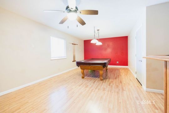 816 West Wasp Avenue Ridgecrest, CA 93555 - Photo 15 of 43 a room with wooden floor and pool table