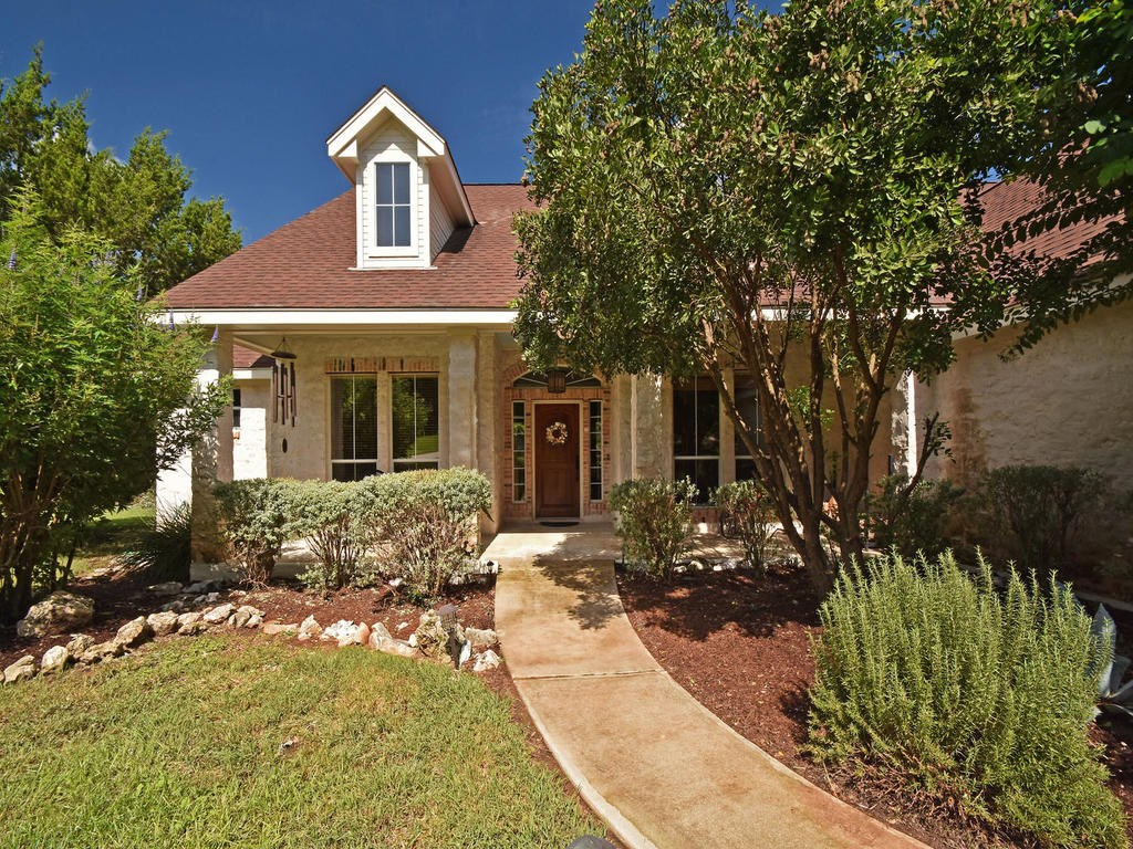 8110 Little Spring Lane Austin, TX 78737 - Photo 1 of 1 Covered front porch has views of spacious front yard.