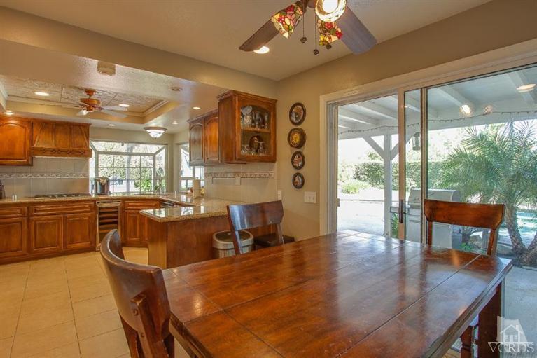 3606 Claridge Court Simi Valley, CA 93063 - Photo 16 of 58 a large dining space with furniture a chandelier and wooden floor