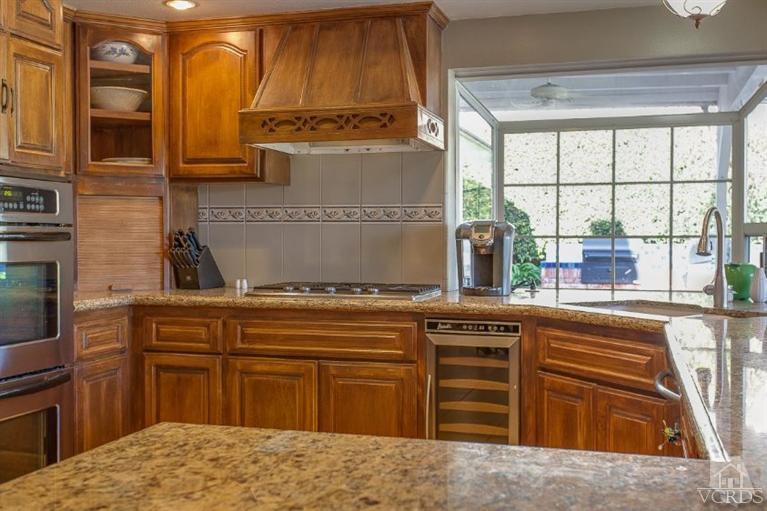 3606 Claridge Court Simi Valley, CA 93063 - Photo 19 of 58 a kitchen with stainless steel appliances granite countertop a stove and a sink