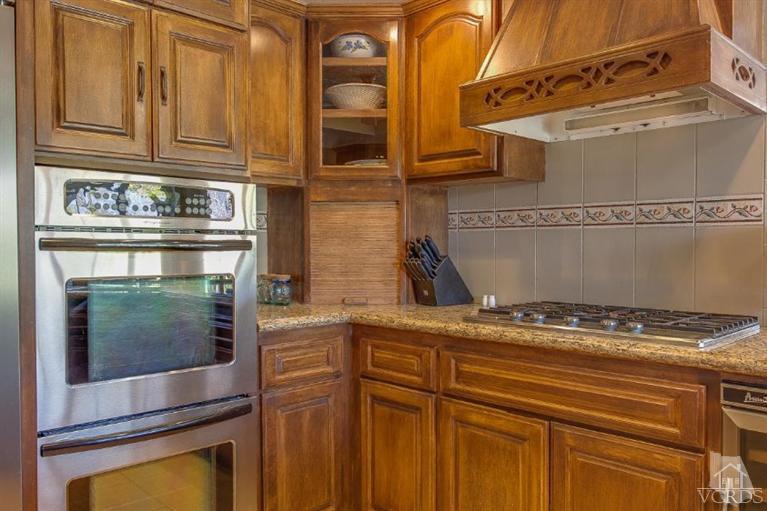 3606 Claridge Court Simi Valley, CA 93063 - Photo 20 of 58 a kitchen with granite countertop a stove and a sink