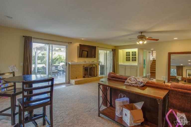 3606 Claridge Court Simi Valley, CA 93063 - Photo 27 of 58 a living room with furniture and a fireplace