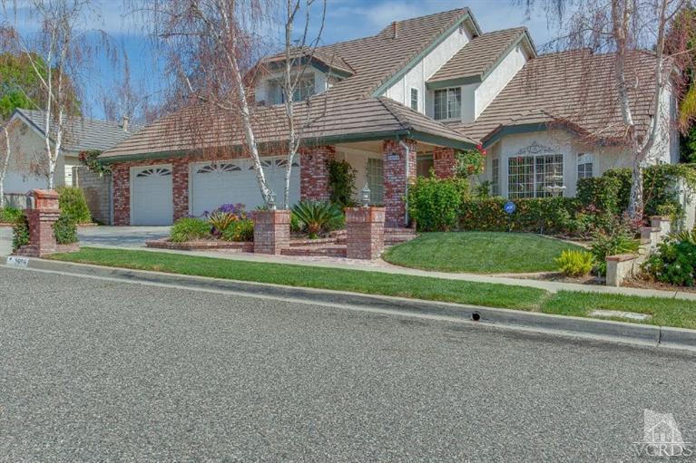 3606 Claridge Court Simi Valley, CA 93063 - Photo 4 of 58 a front view of a house with a yard and garage