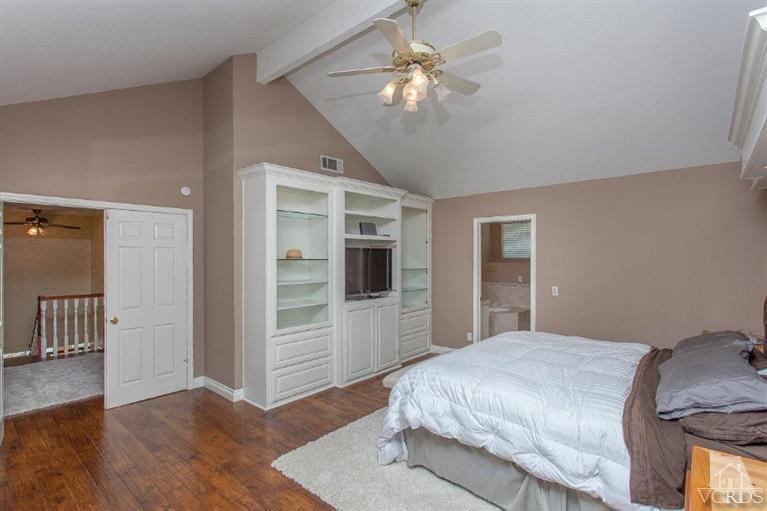 3606 Claridge Court Simi Valley, CA 93063 - Photo 40 of 58 a spacious bedroom with a bed and a chandelier