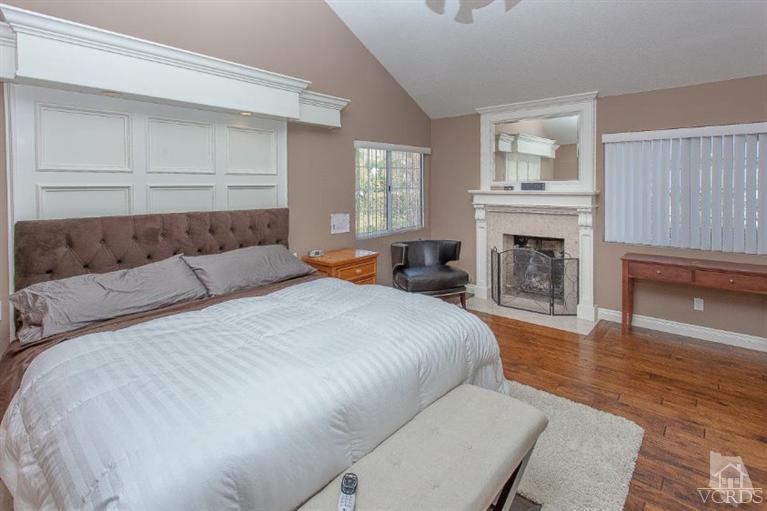 3606 Claridge Court Simi Valley, CA 93063 - Photo 42 of 58 a spacious bedroom with a bed and a fireplace
