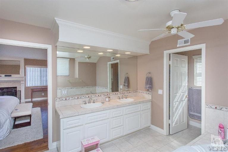 3606 Claridge Court Simi Valley, CA 93063 - Photo 44 of 58 a bathroom with a double vanity sink mirror and double