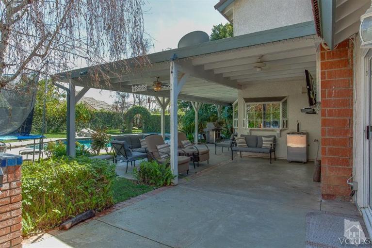 3606 Claridge Court Simi Valley, CA 93063 - Photo 48 of 58 a view of a patio with table and chairs under an umbrella