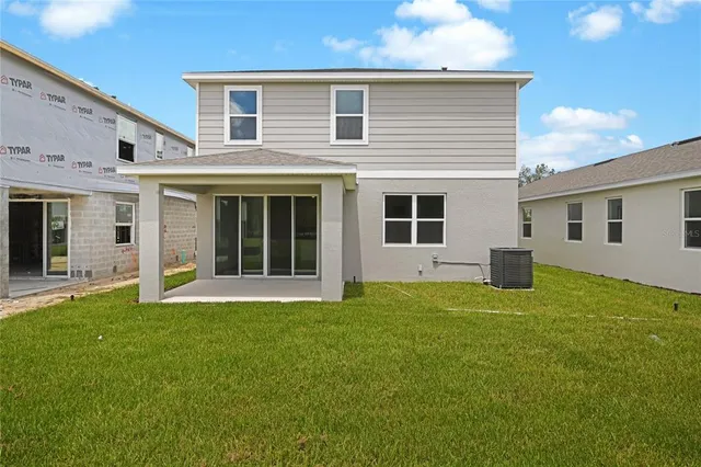 a house that has a big yard in front of it