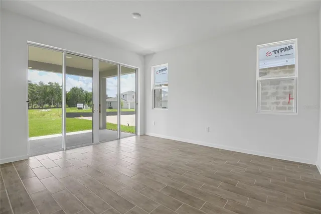 a view of an empty room with glass door