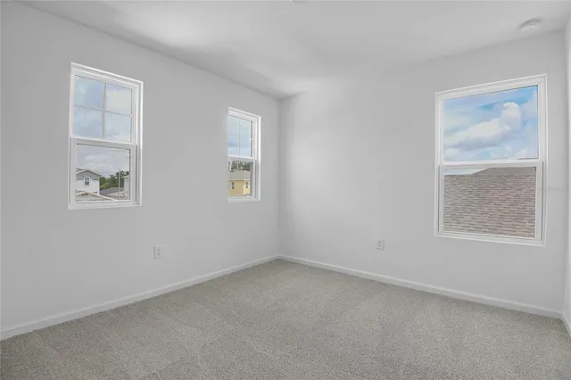 an empty room with windows