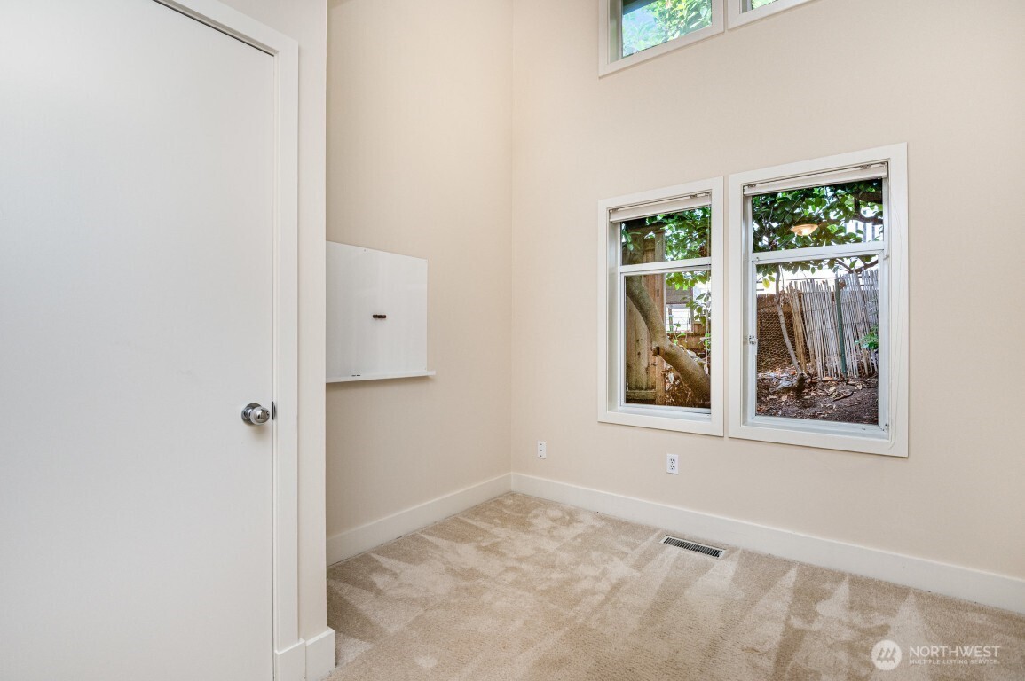 2216 19th Avenue East Seattle, WA 98112 - Photo 11 of 23 an empty room with windows