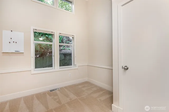 a bathroom with a tub sink double vanity and mirror