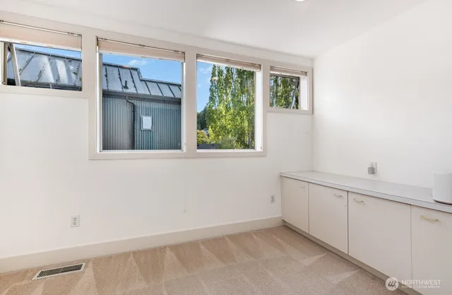 an empty room with windows