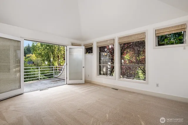 a view of bathroom with a washer and dryer