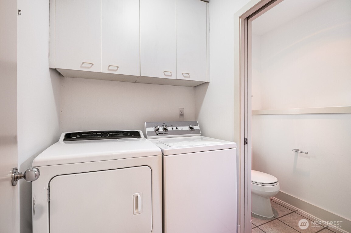 2216 19th Avenue East Seattle, WA 98112 - Photo 20 of 23 a view of bathroom with a washer and dryer
