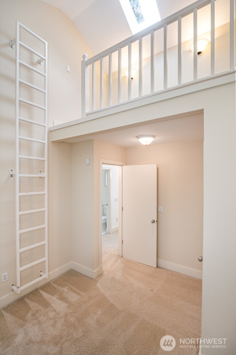 2216 19th Avenue East Seattle, WA 98112 - Photo 10 of 23 a view of an empty room with cabinet and entryway