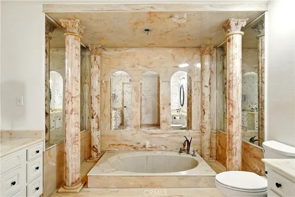 a bathroom with a double vanity sink mirror and a