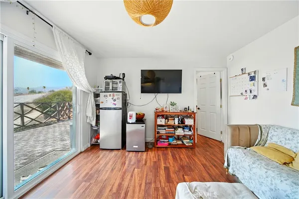 a bathroom with a sink a mirror a toilet and a shower curtain
