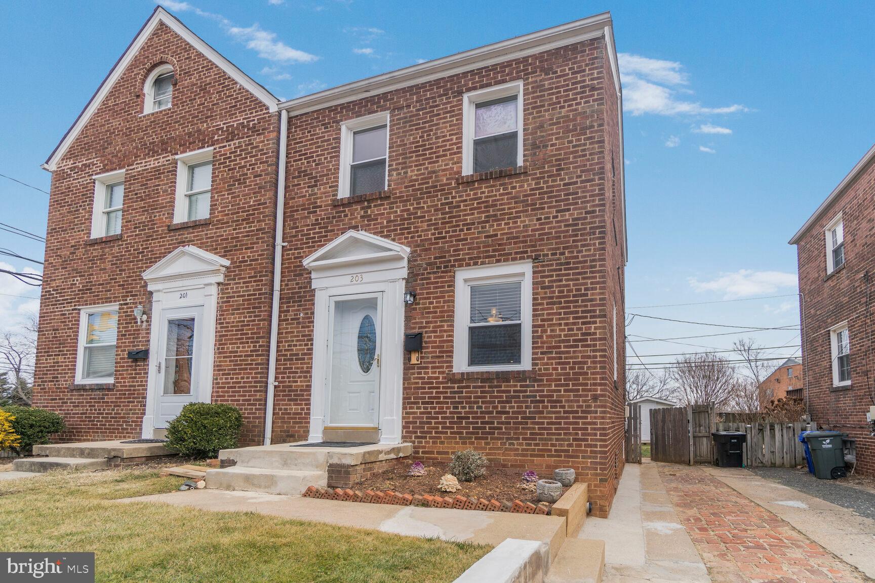203 South Courthouse Road Arlington, VA 22204 - Photo 2 of 43 a front view of a house with a yard