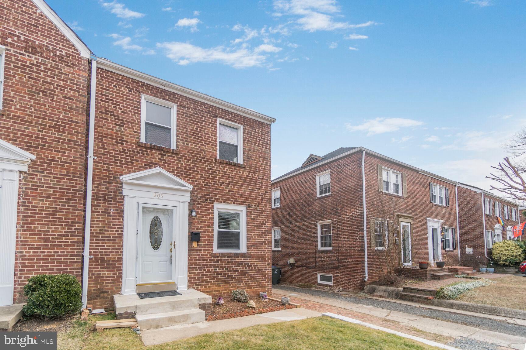 203 South Courthouse Road Arlington, VA 22204 - Photo 3 of 43 a front view of a house with a yard