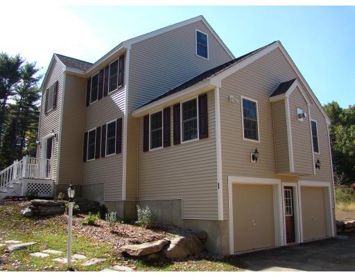 66 Parker Road Shirley, MA 01464 - Photo 1 of 24 a front view of a house with a yard