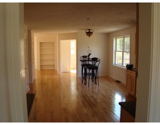 66 Parker Road Shirley, MA 01464 - Photo 13 of 24 a view of a livingroom with furniture wooden floor and front door