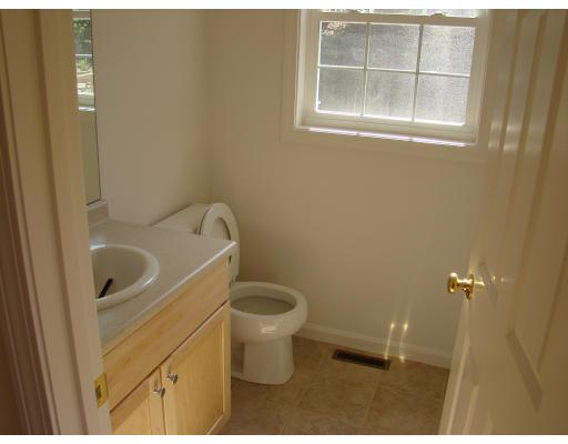 66 Parker Road Shirley, MA 01464 - Photo 14 of 24 a bathroom with a toilet and a sink
