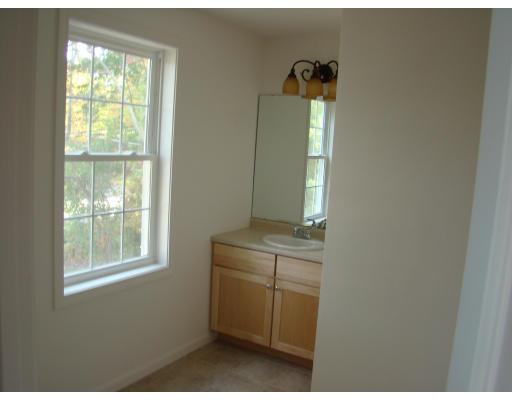 66 Parker Road Shirley, MA 01464 - Photo 18 of 24 a room with cabinets and window