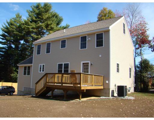 66 Parker Road Shirley, MA 01464 - Photo 5 of 24 a front view of a house with a yard