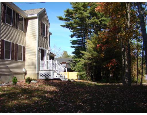 66 Parker Road Shirley, MA 01464 - Photo 8 of 24 a view of a house with a yard