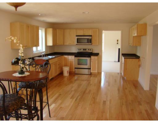 66 Parker Road Shirley, MA 01464 - Photo 10 of 24 a kitchen with stainless steel appliances granite countertop a refrigerator a stove top oven a sink and dishwasher