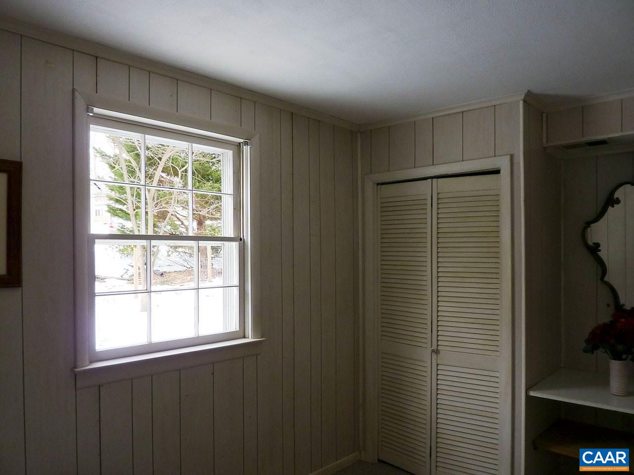 720 Village Road Charlottesville, VA 22903 - Photo 18 of 22 a view of an empty room with a window