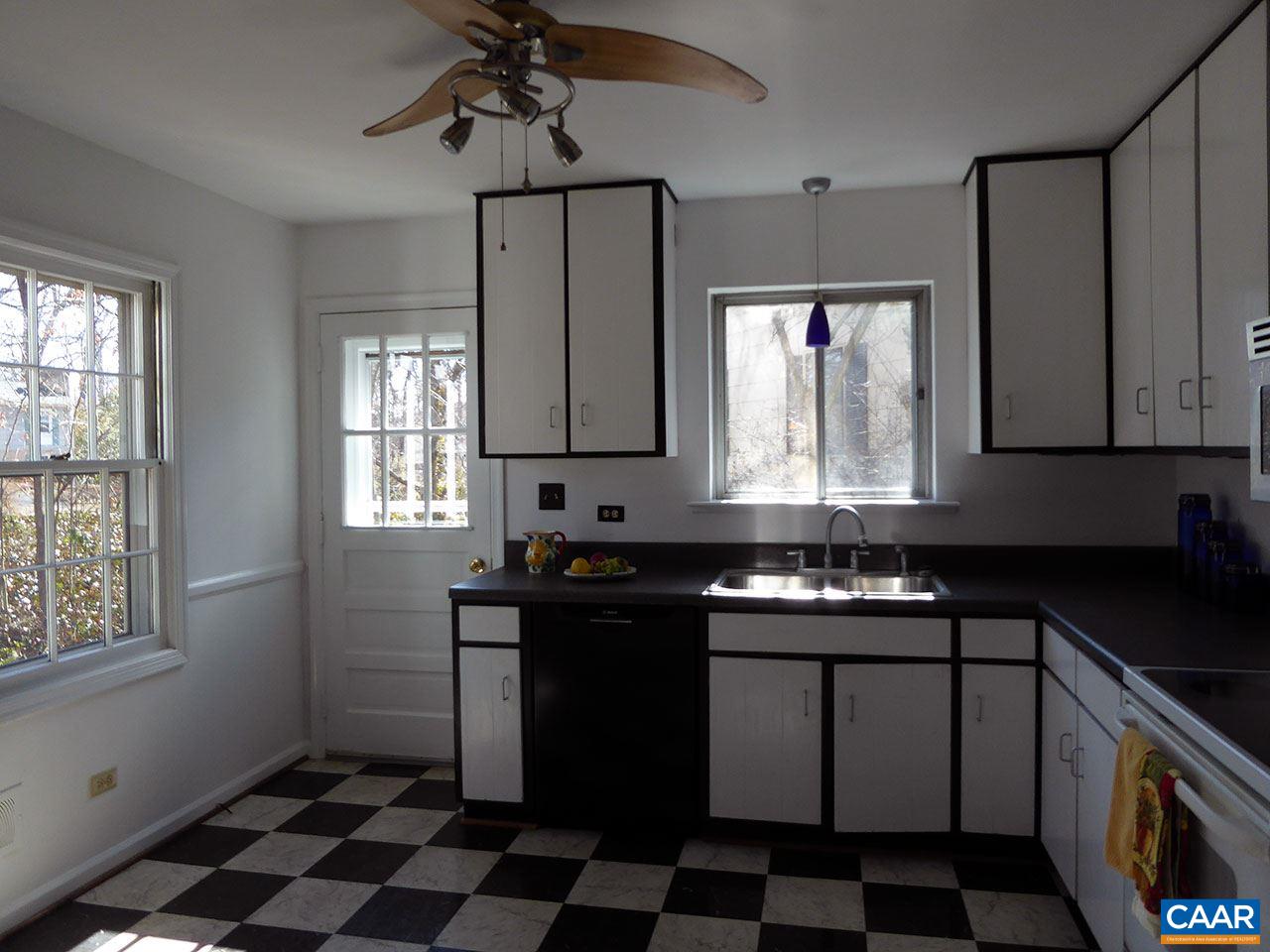 720 Village Road Charlottesville, VA 22903 - Photo 7 of 22 a kitchen with a sink a stove cabinets and a window