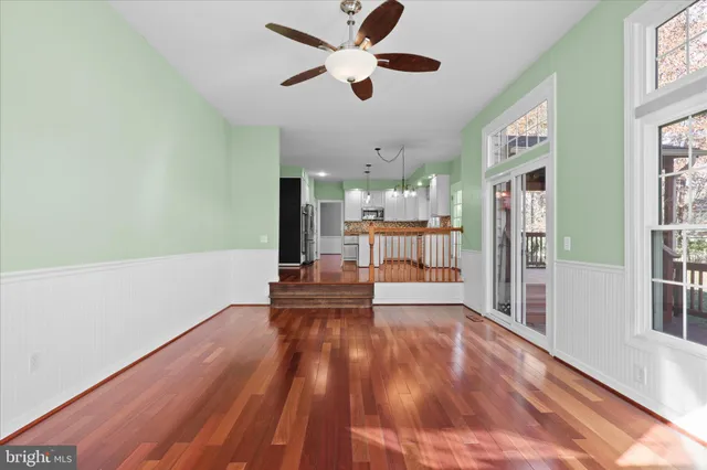 a view of a living room with wooden floor