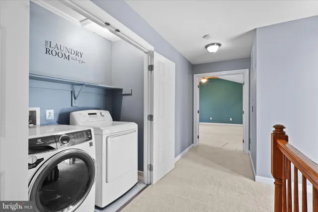 a view of hallway with washer and dryer