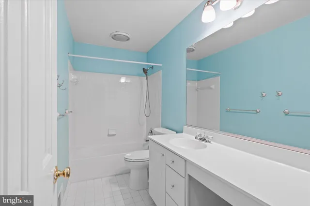 a view of an empty room with a hallway