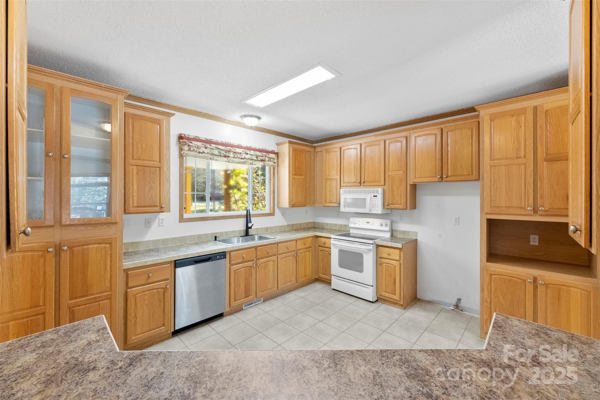 2411 Mission Road York, SC 29745 - Photo 13 of 30 a large kitchen with a large window in it and kitchen island