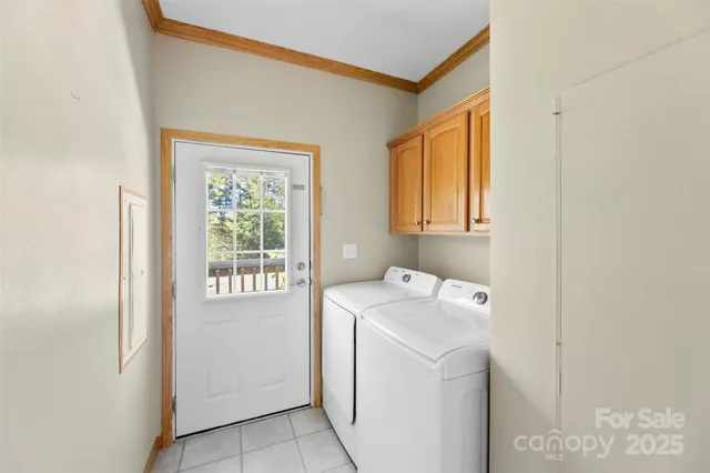 a view of a big room with wooden floor and windows