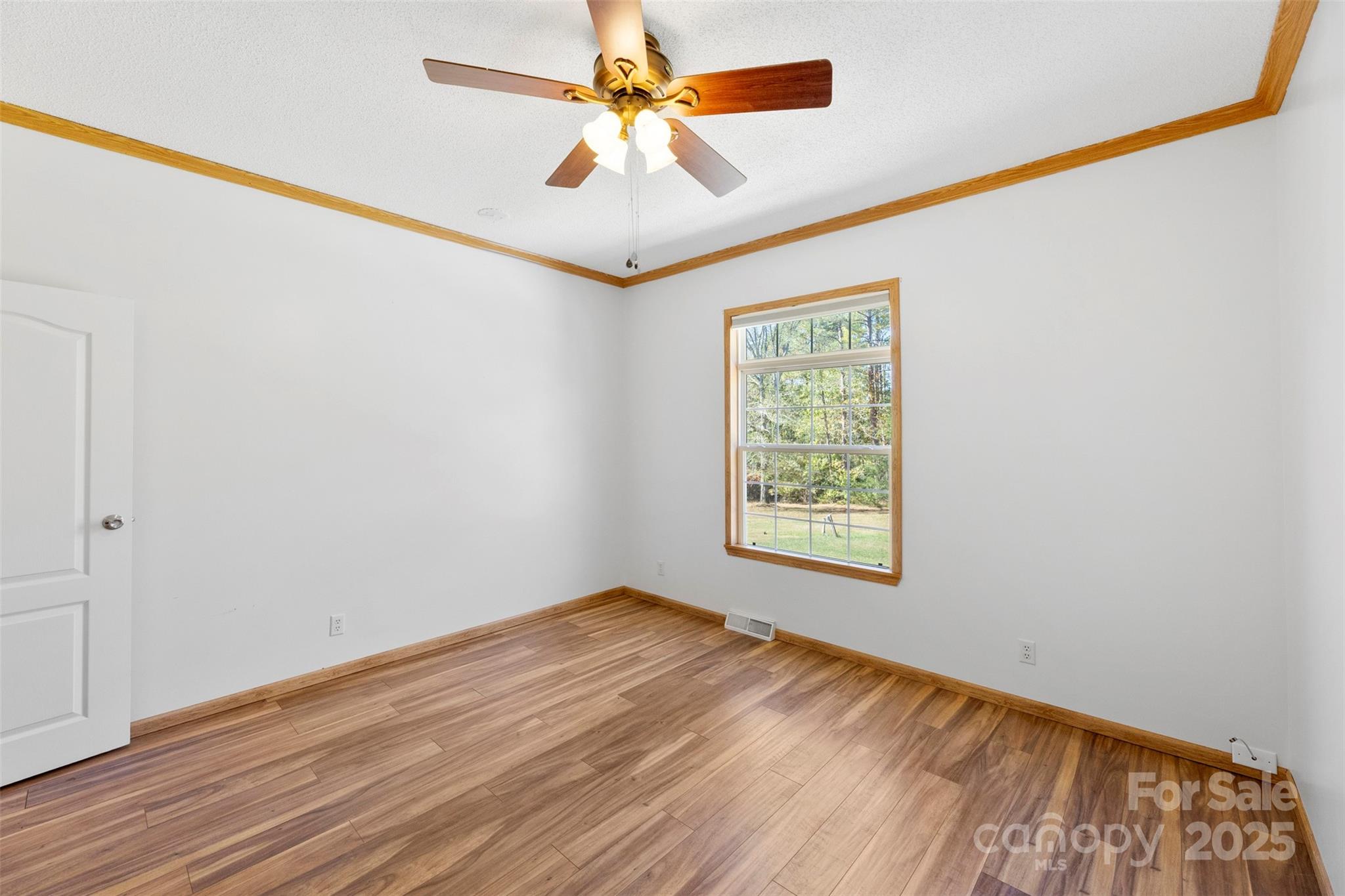 2411 Mission Road York, SC 29745 - Photo 19 of 30 wooden floor in an empty room with a window